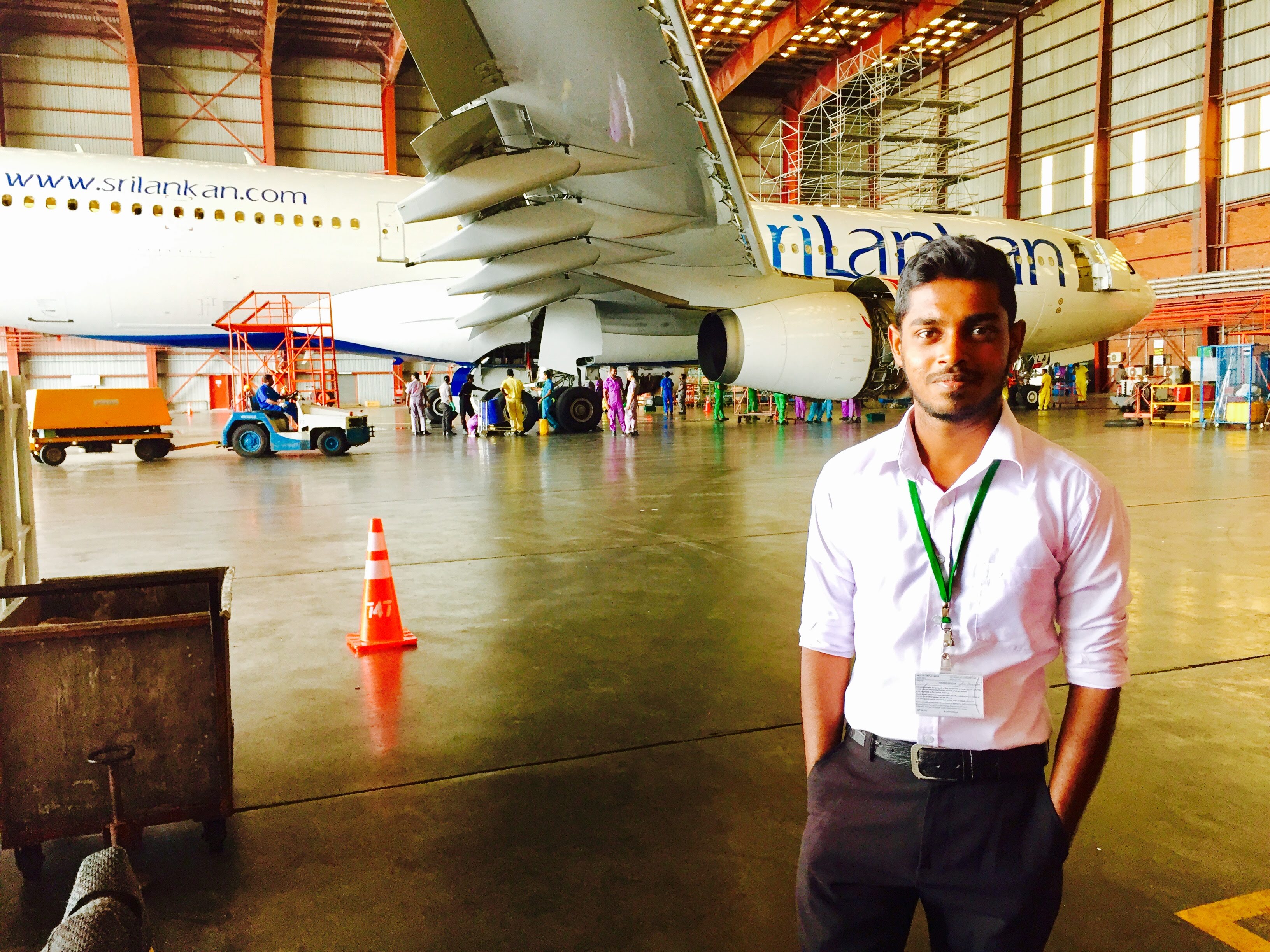 Naveen Chamara in an aircraft cockpit during his aviation engineering training