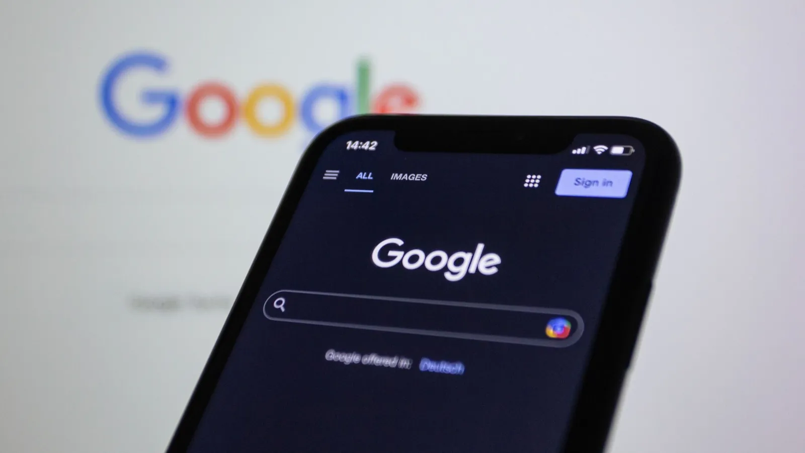 Smartphone showing Google search, where answer engine optimization wins featured snippets