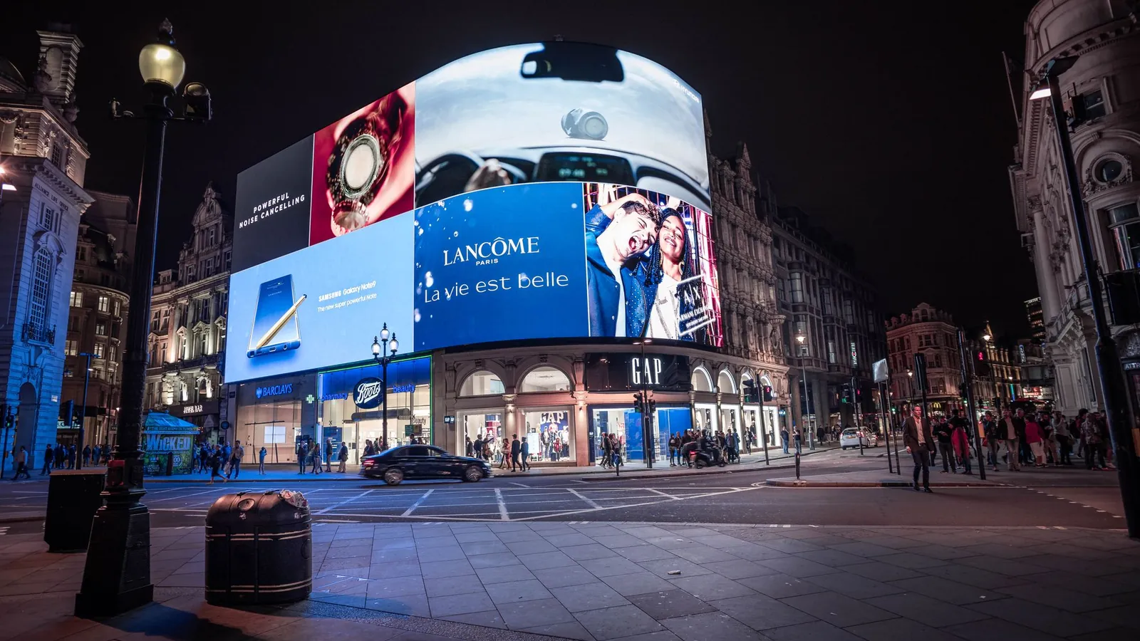 Illuminated billboards at Piccadilly Circus, an example of traditional marketing